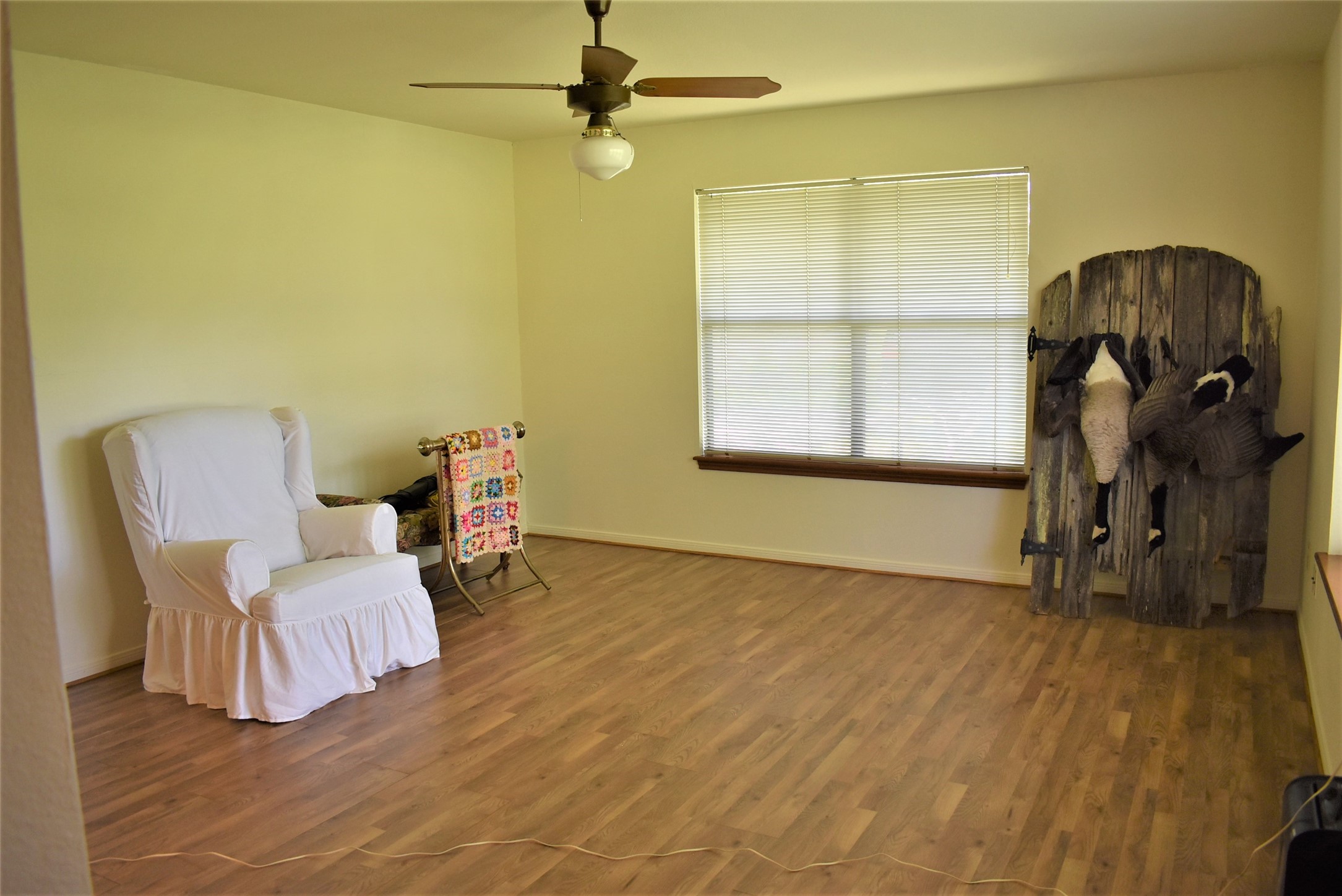 8854 FM 524 Road Sweeny, TX 77480 - Photo 18 of 45 a bedroom with a bed and wooden floor