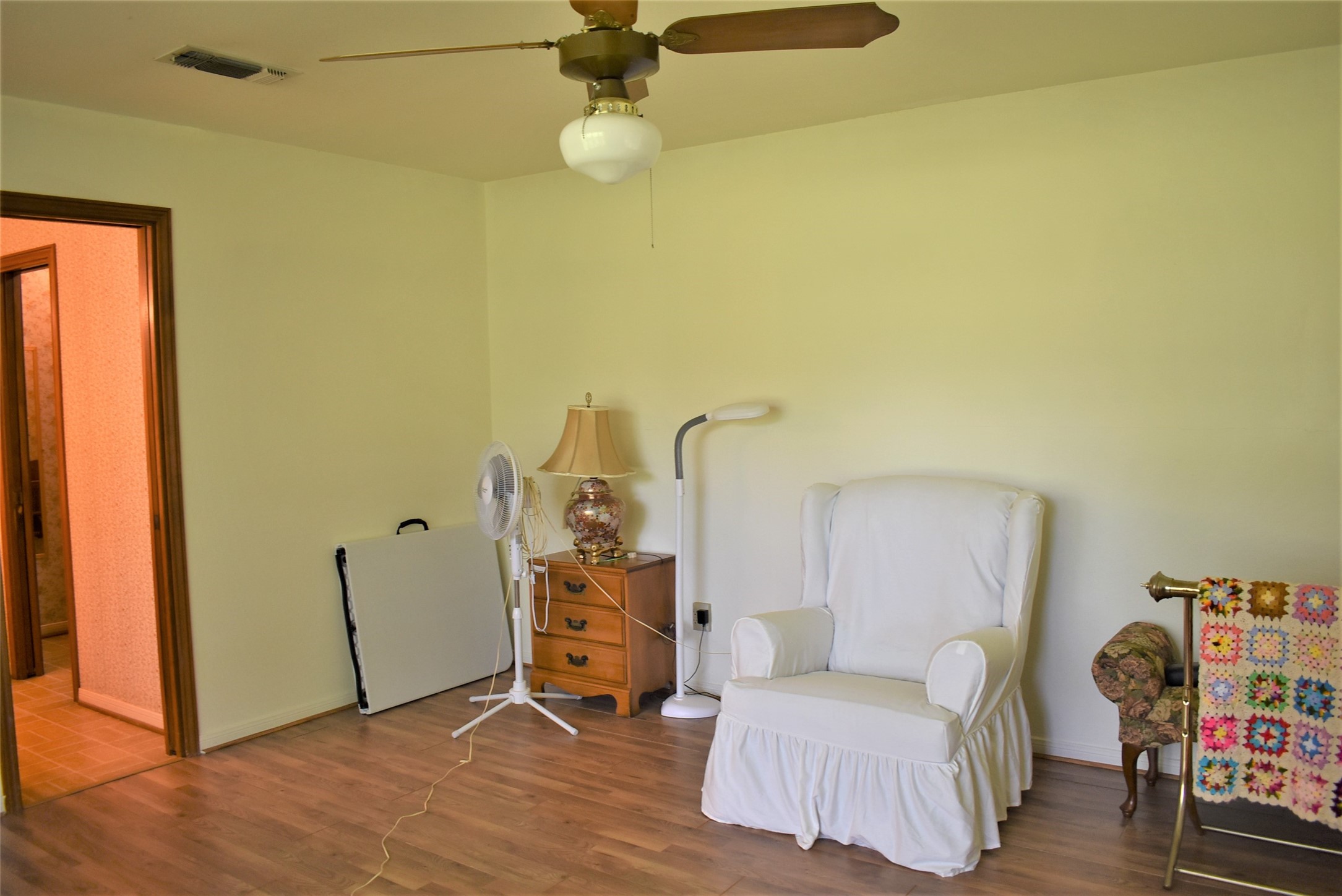 8854 FM 524 Road Sweeny, TX 77480 - Photo 19 of 45 a bedroom with a bed and a chandelier