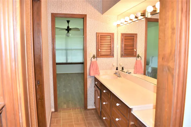 a bathroom with a double vanity sink and a bathtub