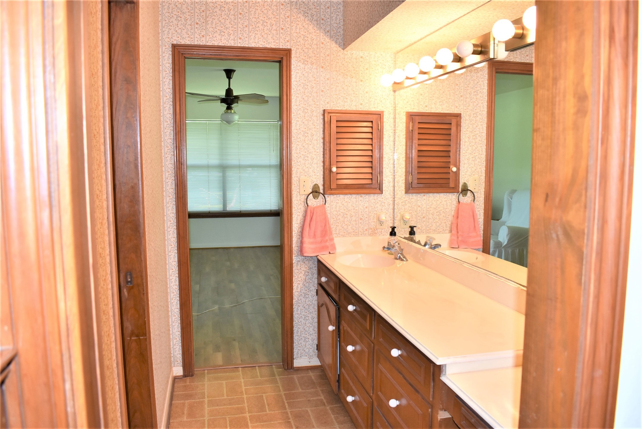 8854 FM 524 Road Sweeny, TX 77480 - Photo 25 of 45 a bathroom with a double vanity sink and a bathtub