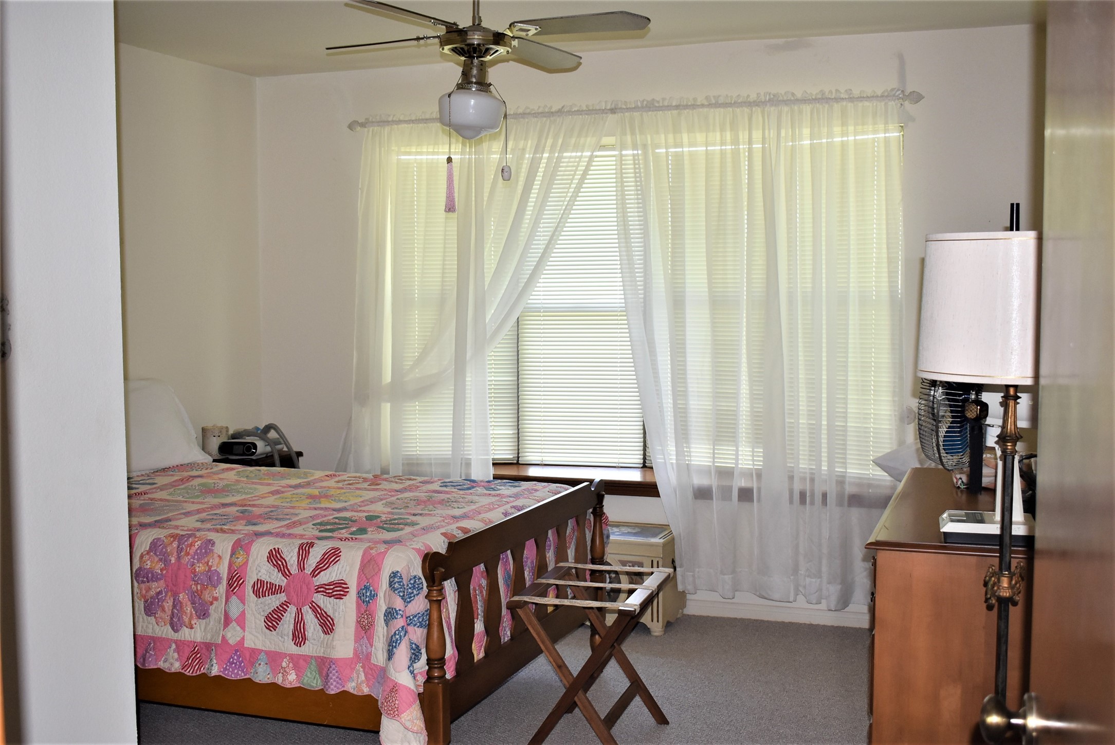 8854 FM 524 Road Sweeny, TX 77480 - Photo 36 of 45 a bedroom with a bed and a window