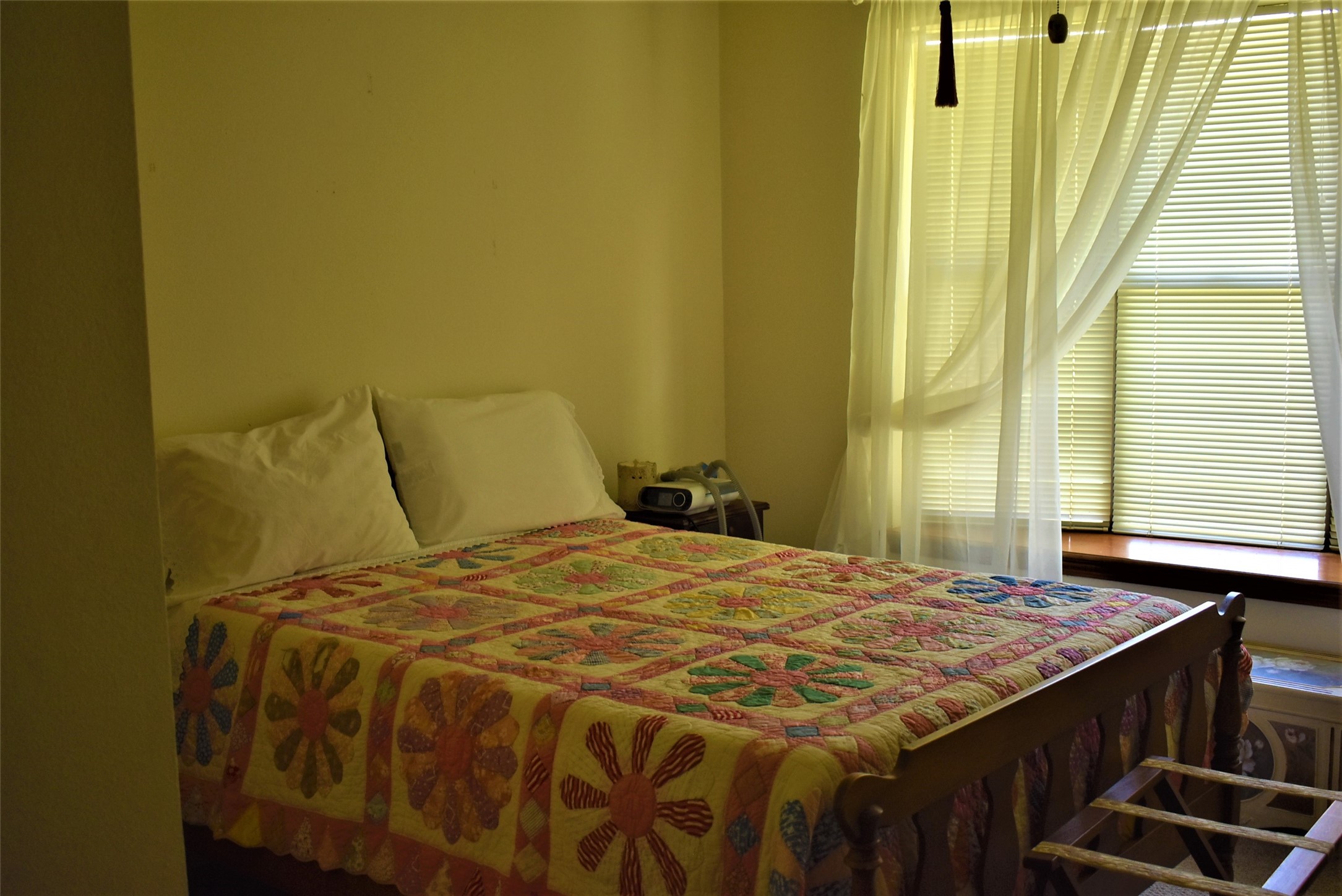 8854 FM 524 Road Sweeny, TX 77480 - Photo 38 of 45 a bed sitting in a bedroom next to a window