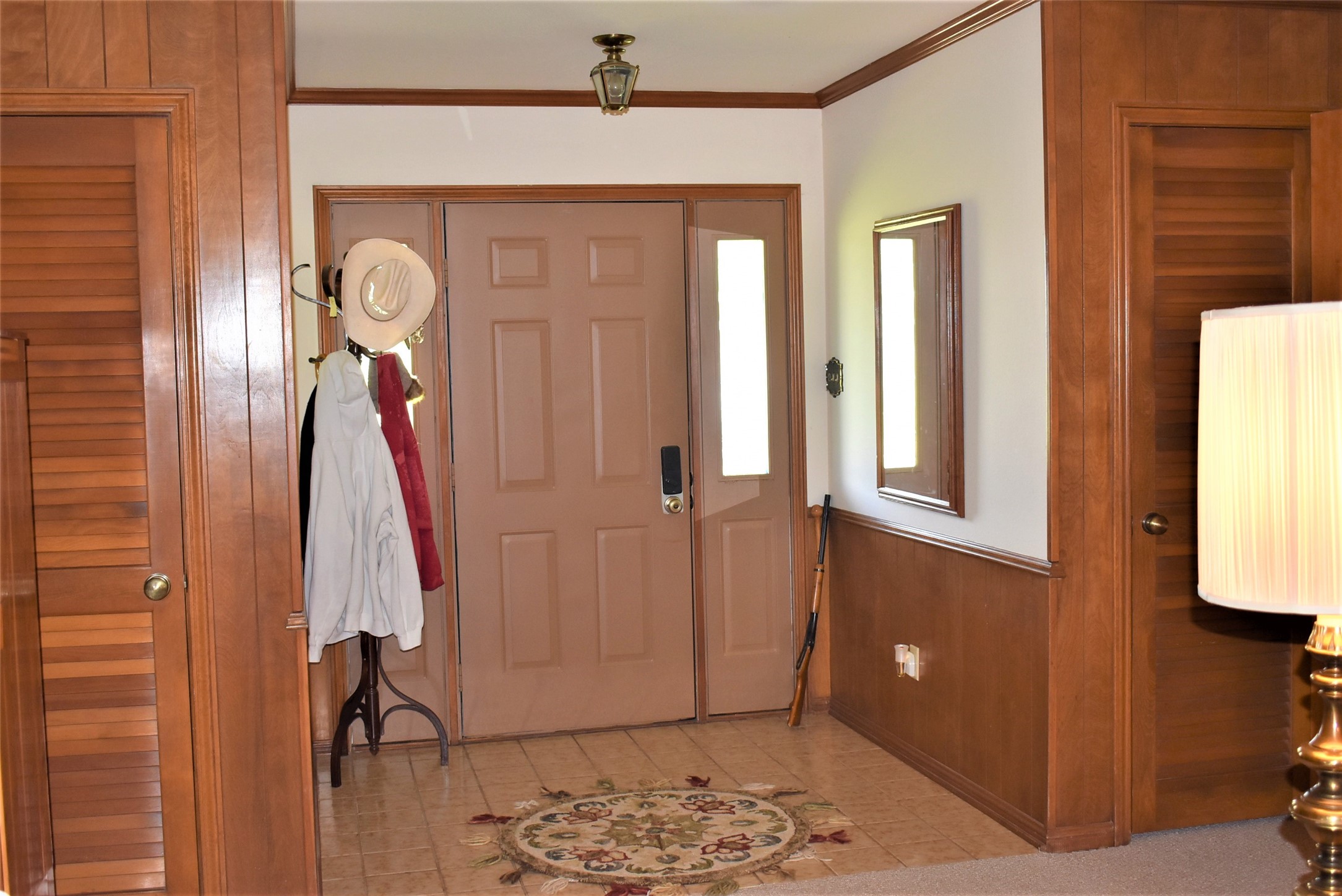 8854 FM 524 Road Sweeny, TX 77480 - Photo 41 of 45 a view of a hallway with entryway wooden floor and front door