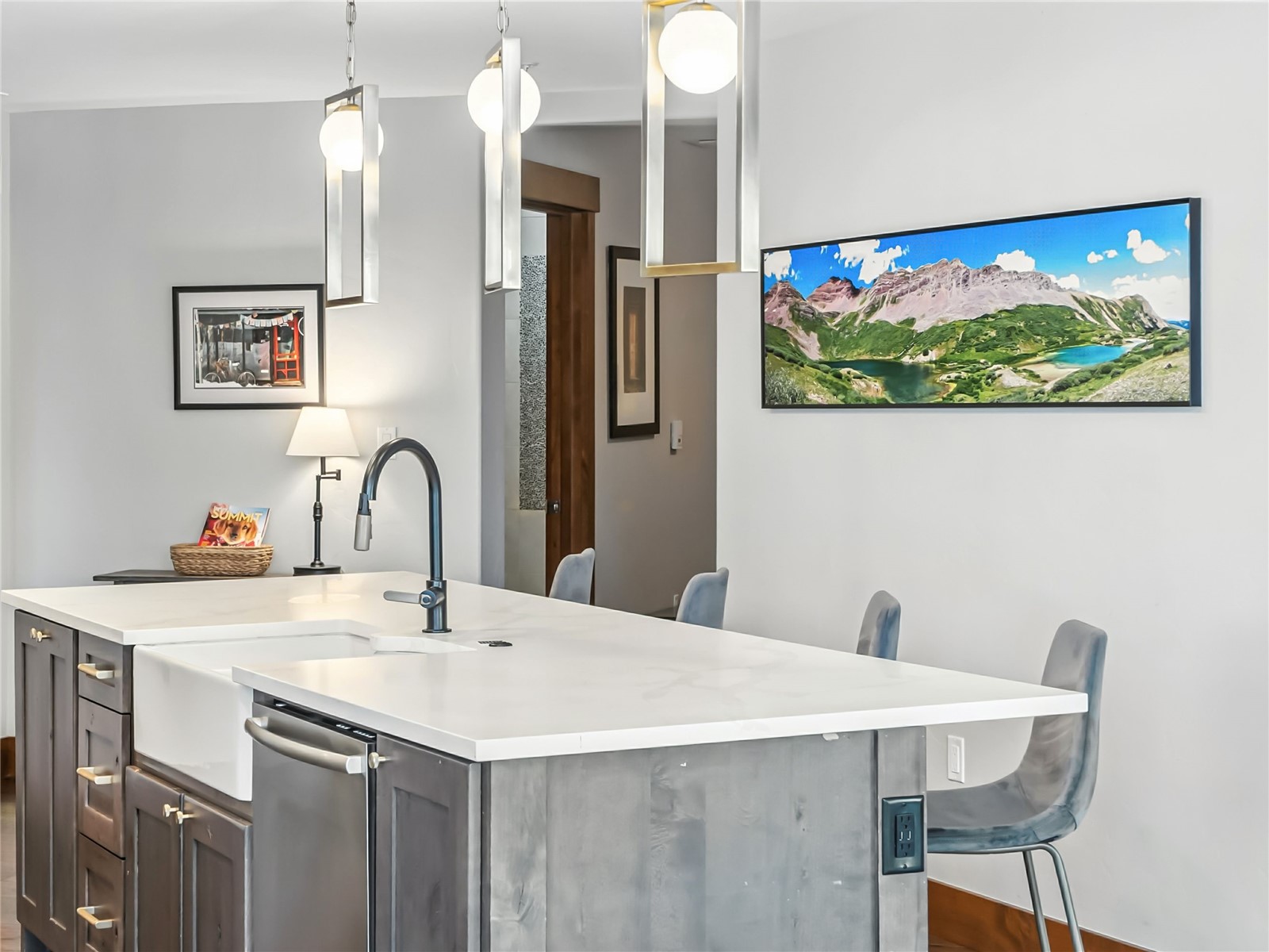 1521 Ski Hill Road, Unit 8424 Breckenridge, CO 80424 - Photo 14 of 41 a kitchen with a sink a table and chairs