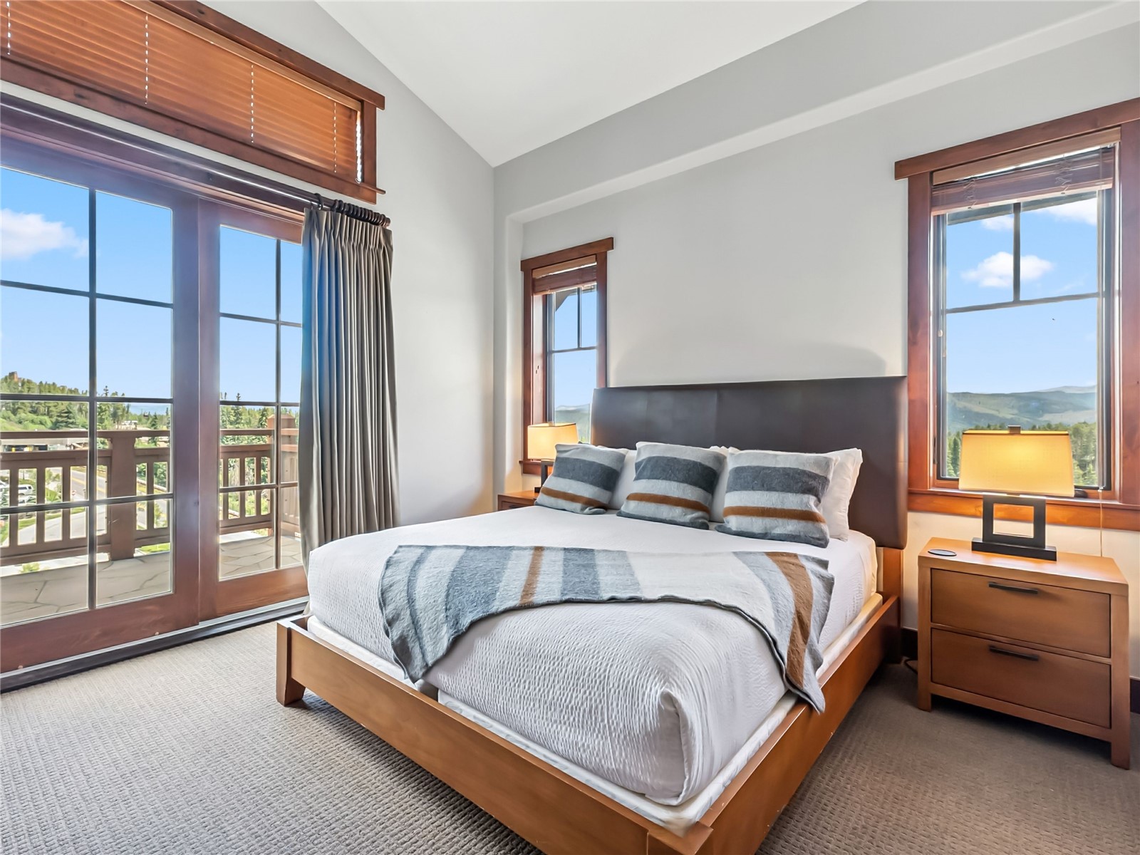 1521 Ski Hill Road, Unit 8424 Breckenridge, CO 80424 - Photo 18 of 41 a bedroom with a bed and a night stand