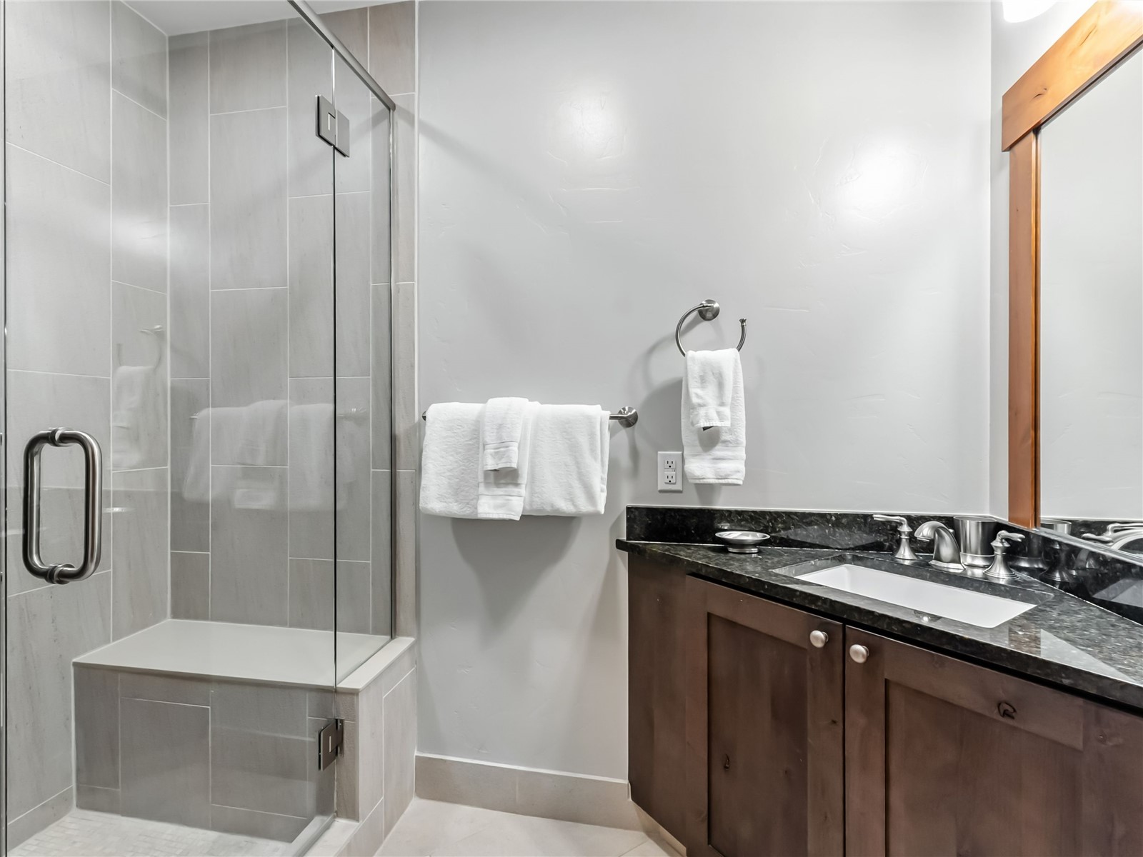 1521 Ski Hill Road, Unit 8424 Breckenridge, CO 80424 - Photo 21 of 41 a bathroom with a sink a mirror and a shower