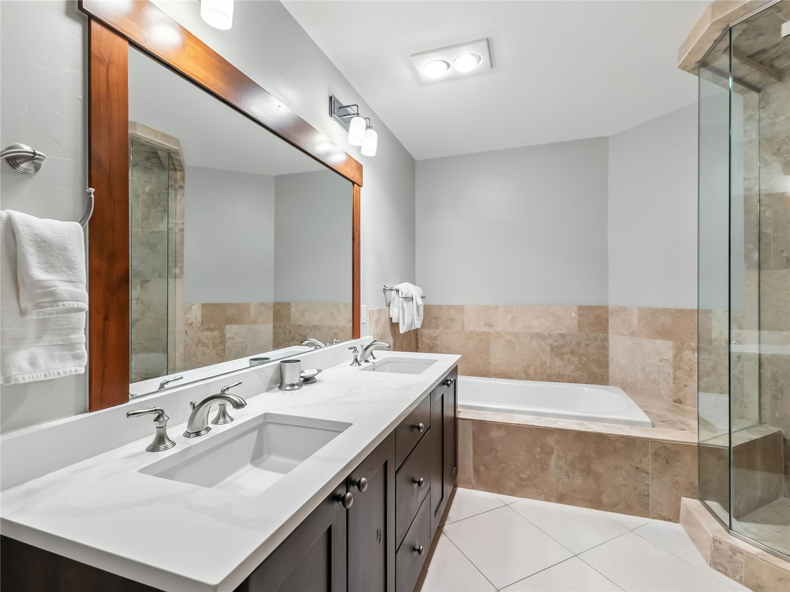 1521 Ski Hill Road, Unit 8424 Breckenridge, CO 80424 - Photo 25 of 41 a bathroom with a sink double vanity mirror and a bathtub