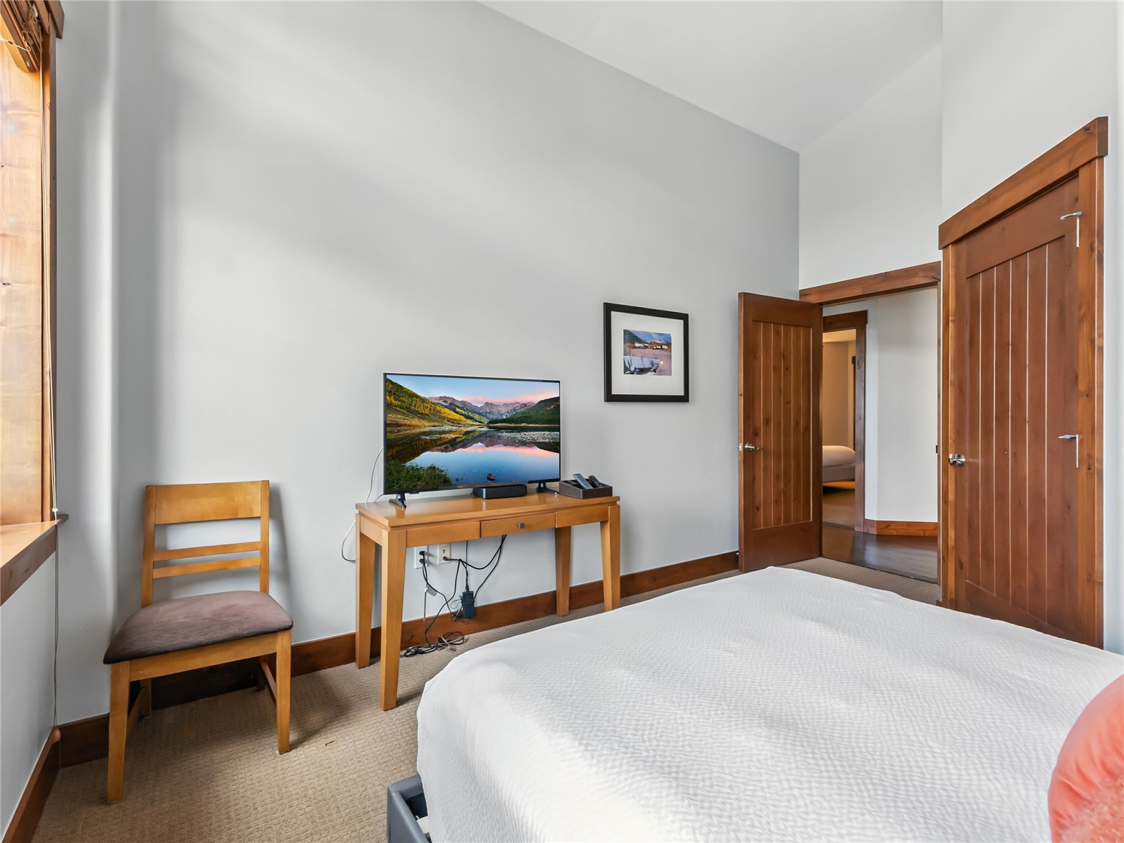 1521 Ski Hill Road, Unit 8424 Breckenridge, CO 80424 - Photo 29 of 41 a bedroom with a bed and a furniture