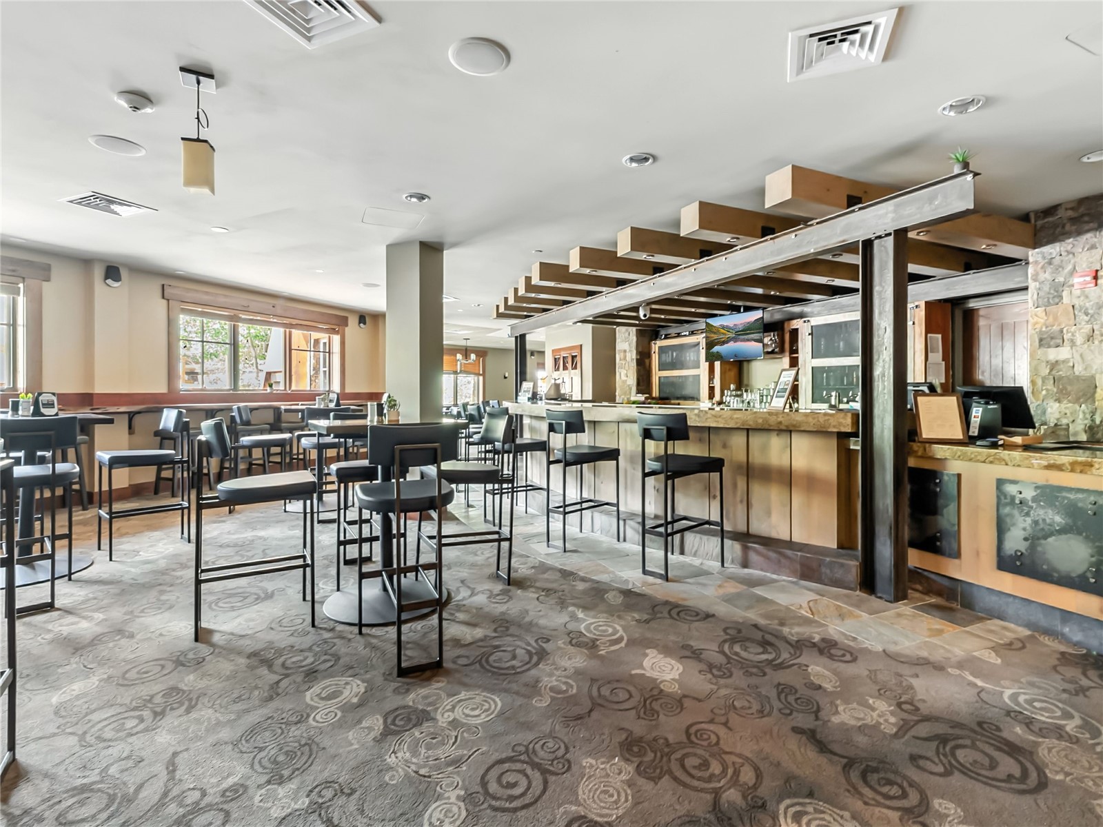 1521 Ski Hill Road, Unit 8424 Breckenridge, CO 80424 - Photo 38 of 41 a living room with lots of furniture and a large mirror