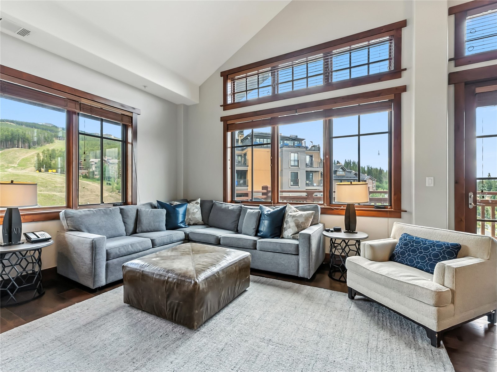 1521 Ski Hill Road, Unit 8424 Breckenridge, CO 80424 - Photo 4 of 41 a living room with furniture and a large window