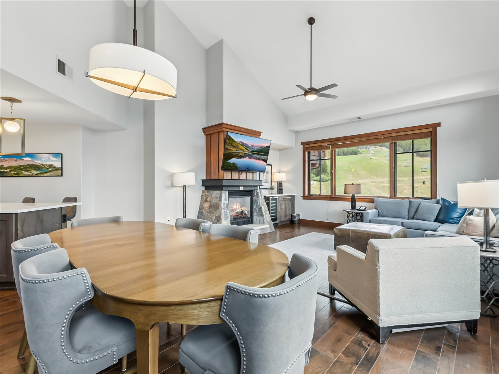 1521 Ski Hill Road, Unit 8424 Breckenridge, CO 80424 - Photo 10 of 41 a living room with furniture a fireplace and a flat screen tv