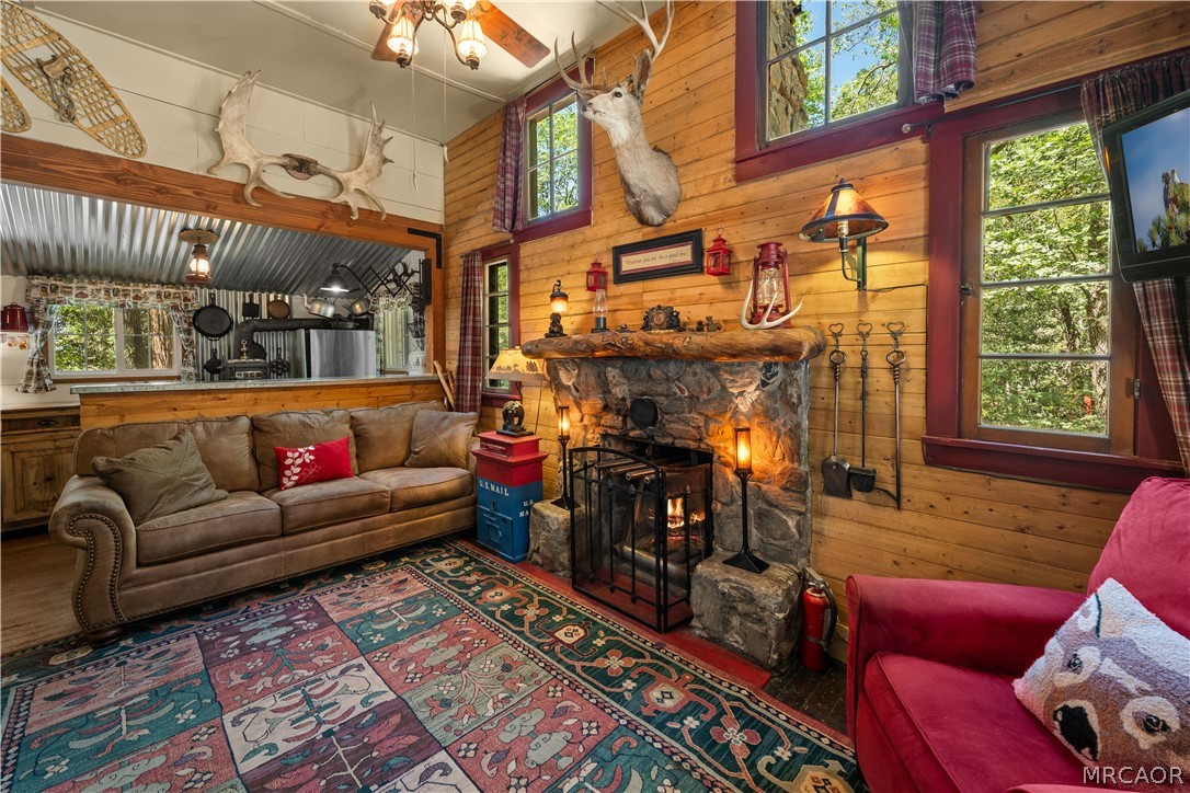 70 Barton Flats Road Angelus Oaks, CA 92305 - Photo 2 of 44 Real rock fireplace and lots of windows to view the Forest outside.