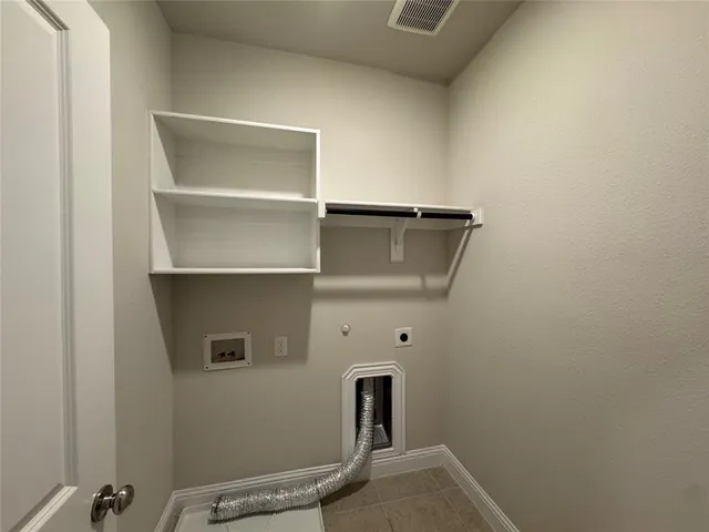 a kitchen with a sink stove top oven and cabinets