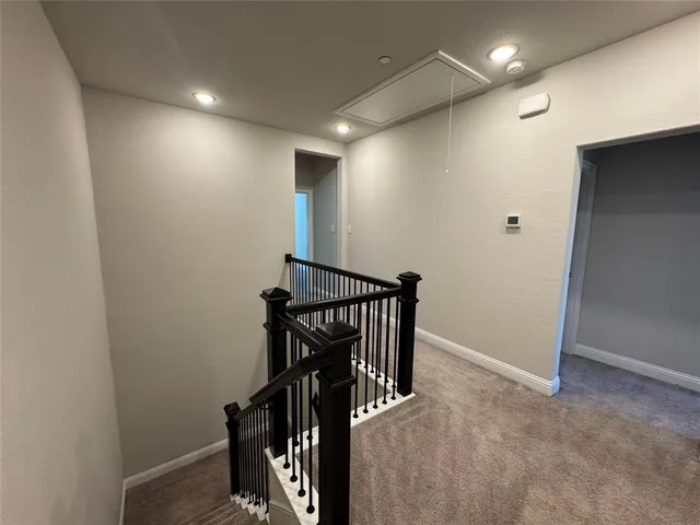 a view of storage and utility room with empty racks