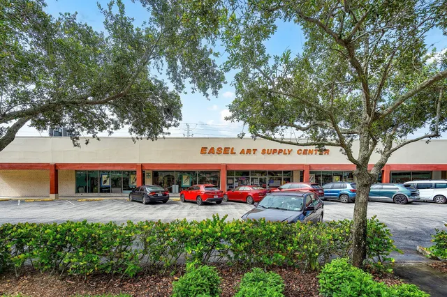 a group of cars parked in front of building