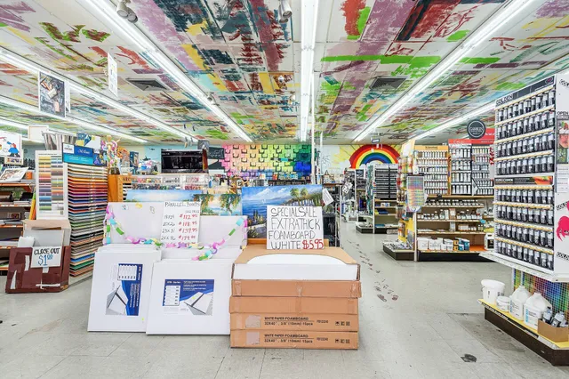 a room with lots of chairs and white walls