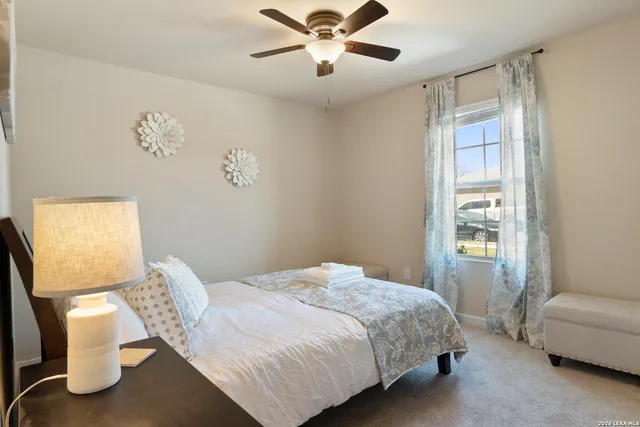 a bedroom with a bed and a couch