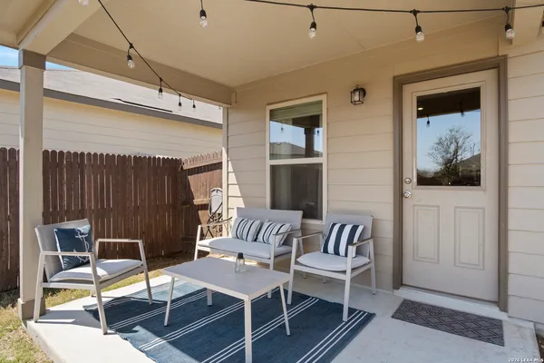 a outdoor space with a couch and chairs