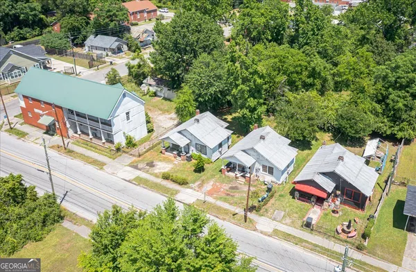 an aerial view of a house with a garden and plants