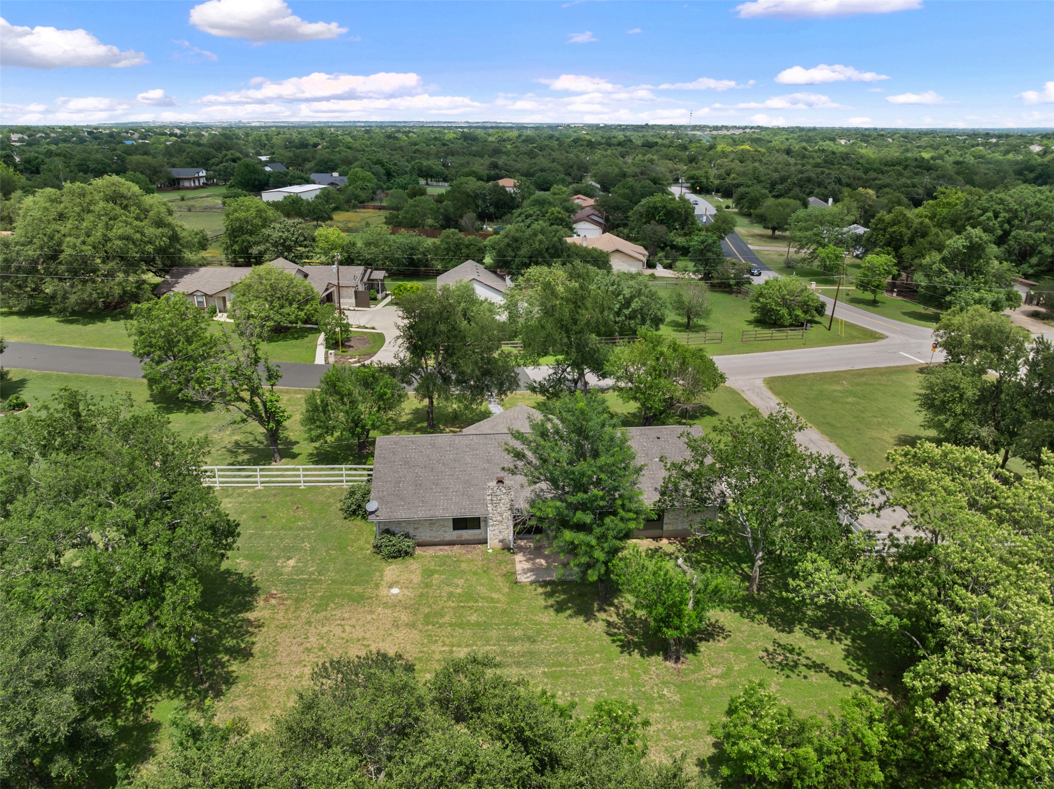 1600 Pin Oak Lane Round Rock, TX 78681 - Photo 39 of 40 Aerial perspective showcasing a single-story residence with a gray shingle roof