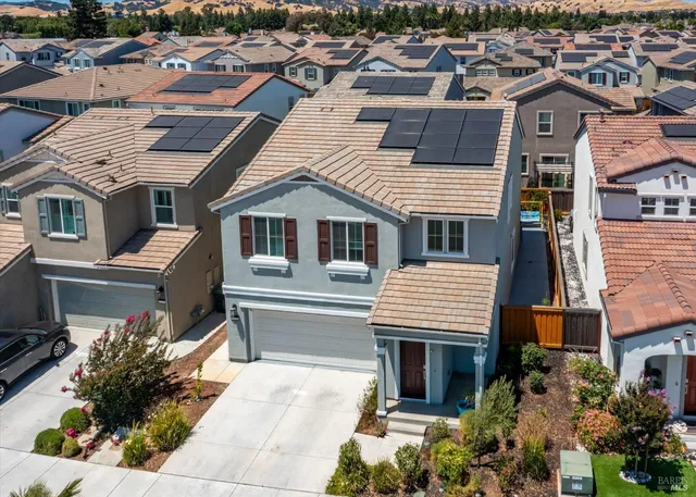 a view of a hallway with wooden floor and entryway