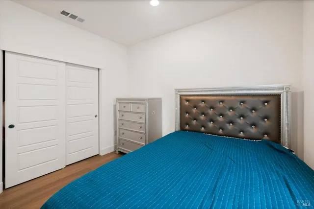 a metallic refrigerator freezer sitting in a kitchen