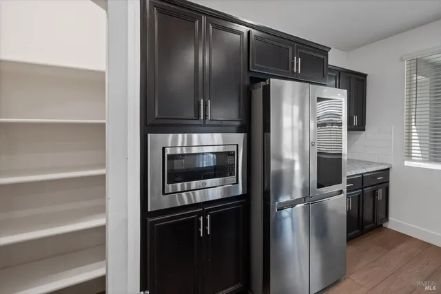 an empty room with cabinet in closet