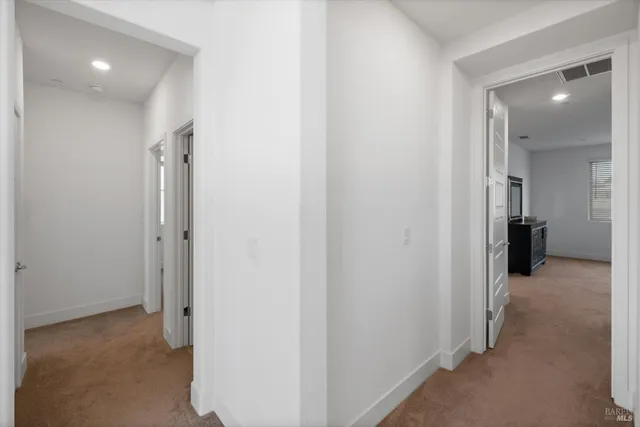 a bedroom with a bed and a tv on dresser