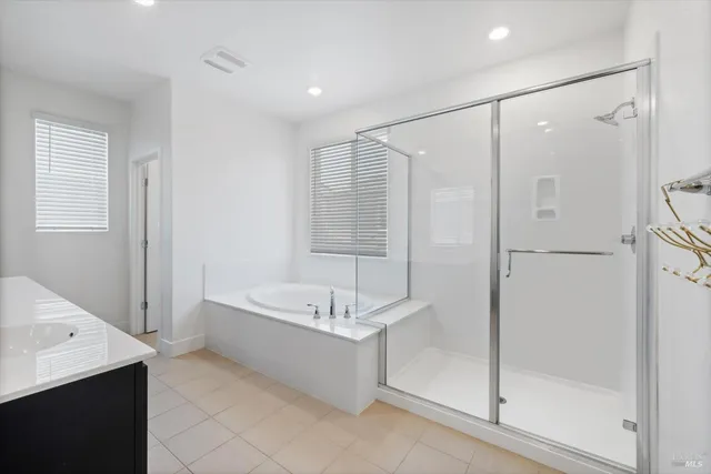 an aerial view of residential houses with city view