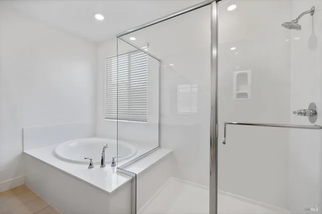 an aerial view of residential houses with city view