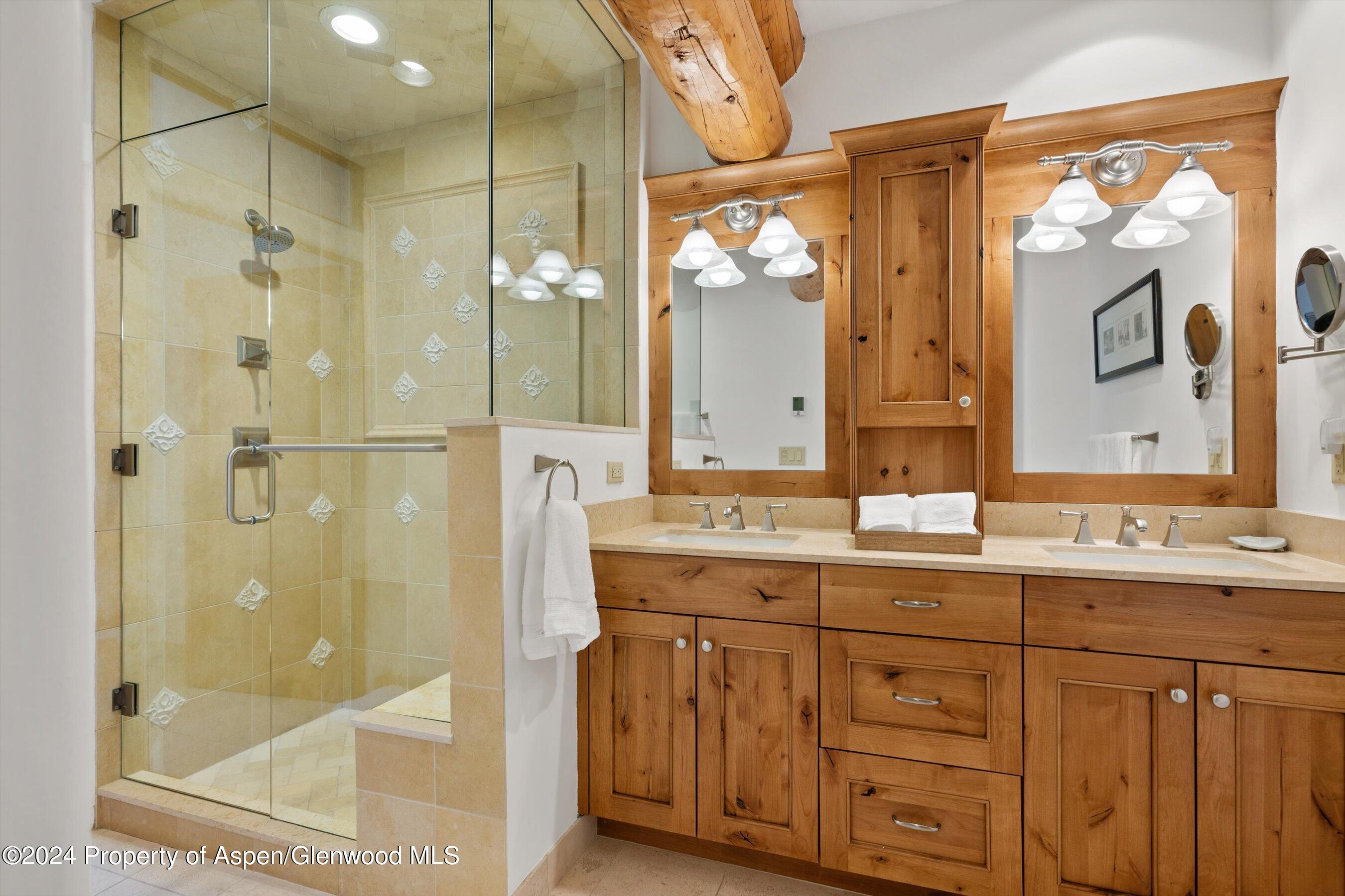 825 Cemetery Lane, Unit 2 Aspen, CO 81611 - Photo 22 of 47 a bathroom with a granite countertop sink mirror and a shower
