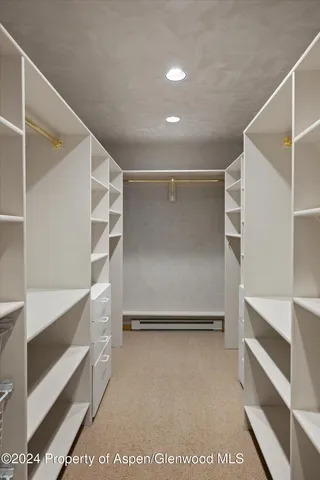 a view of an empty walk in closet