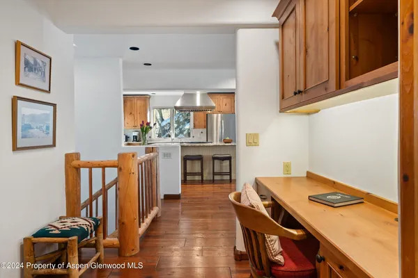 a kitchen that has a stove and a table