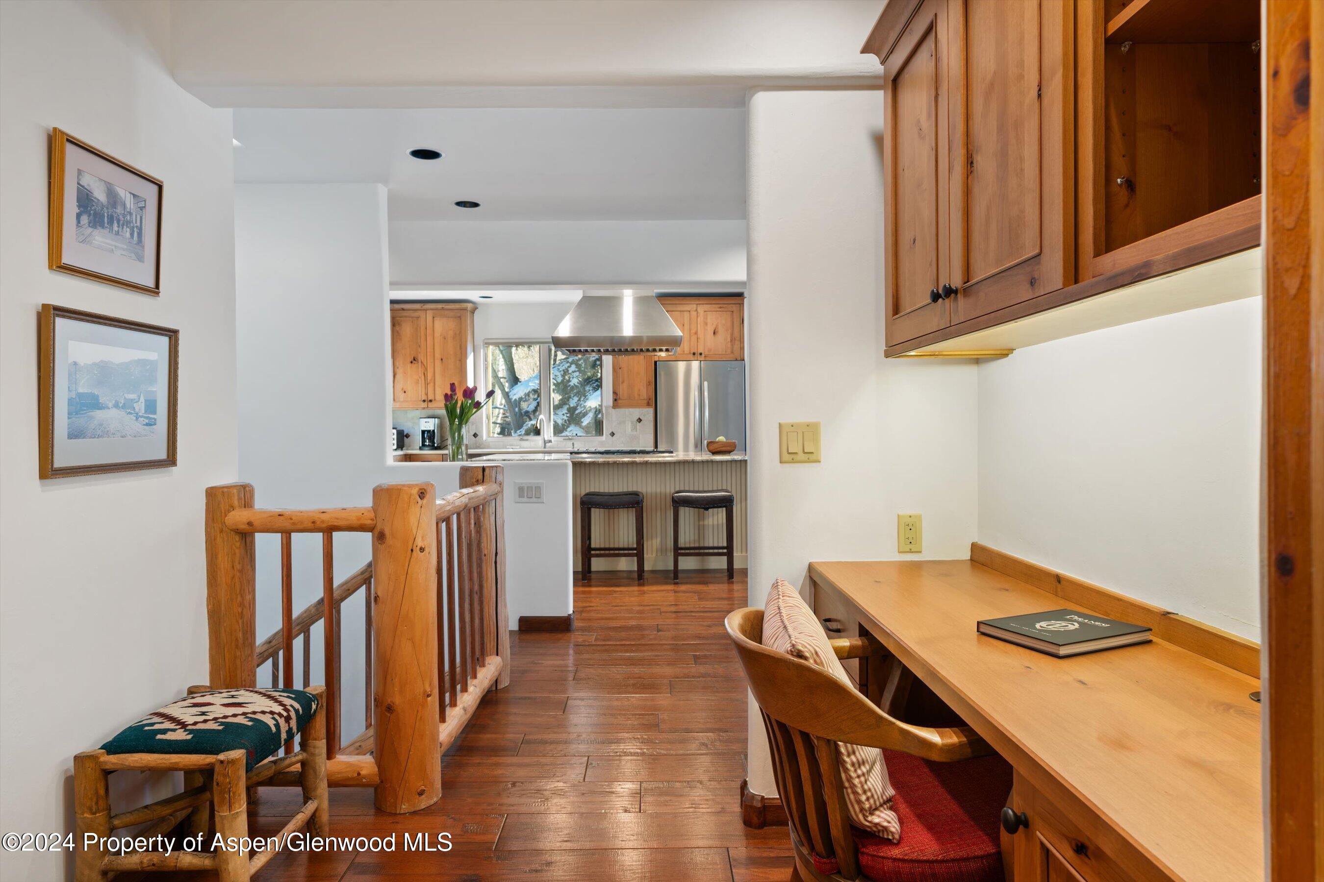 825 Cemetery Lane, Unit 2 Aspen, CO 81611 - Photo 24 of 47 a kitchen that has a stove and a table