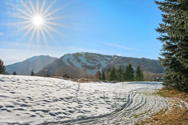 a view of snow on the road