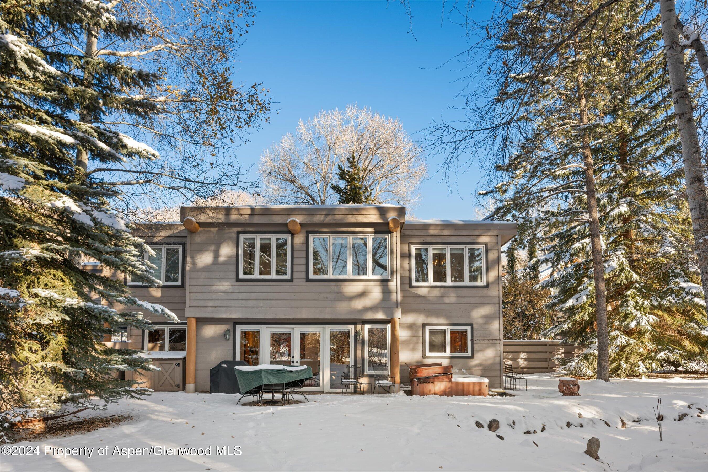 825 Cemetery Lane, Unit 2 Aspen, CO 81611 - Photo 47 of 47 a front view of a building with lot of trees