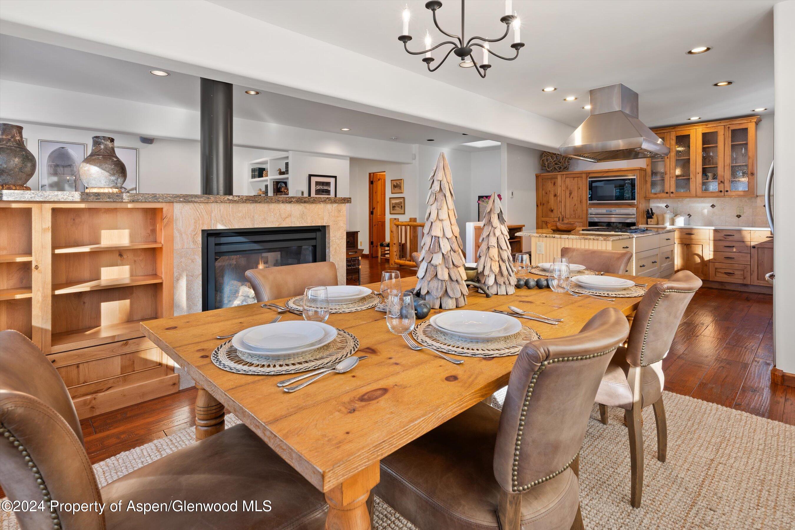 825 Cemetery Lane, Unit 2 Aspen, CO 81611 - Photo 9 of 47 a dining room with furniture and wooden floor