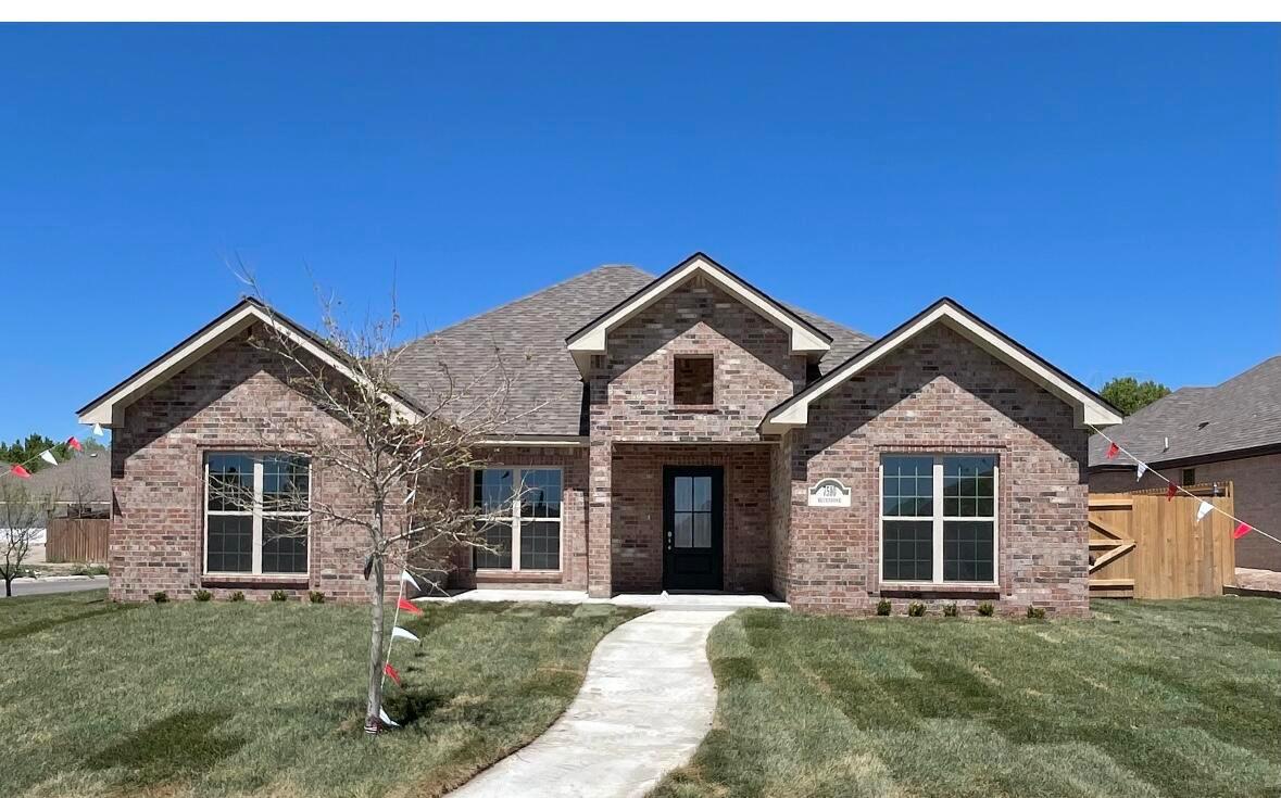 7510 Bluestone Drive Amarillo, TX 79119 - Photo 2 of 4 a front view of a house with a yard