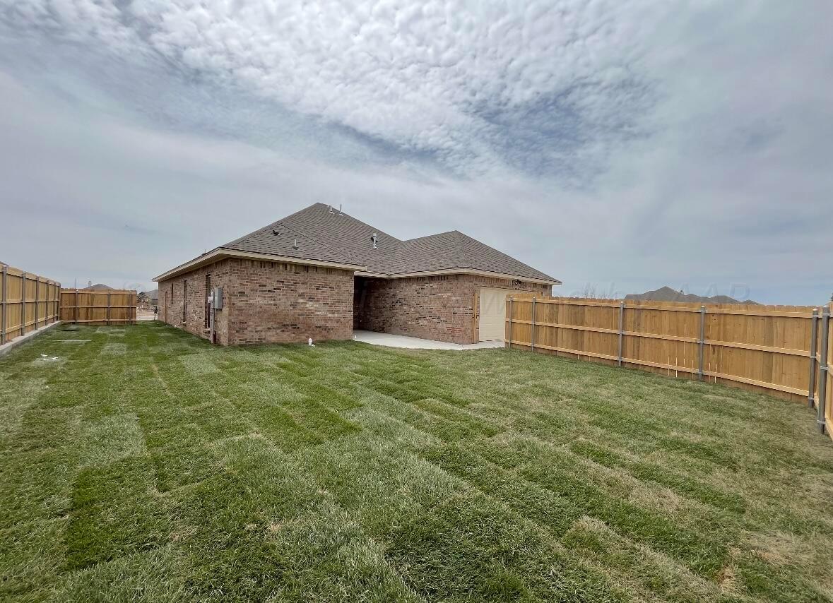 7510 Bluestone Drive Amarillo, TX 79119 - Photo 4 of 4 a backyard of a house with lots of green space