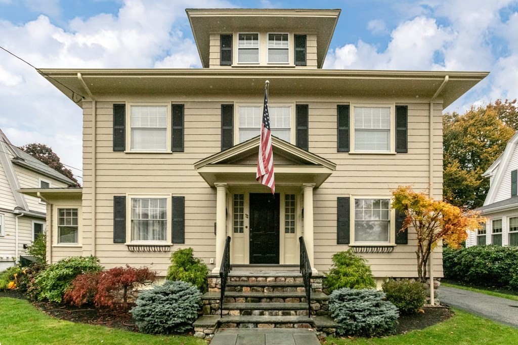 front view of a house with a yard