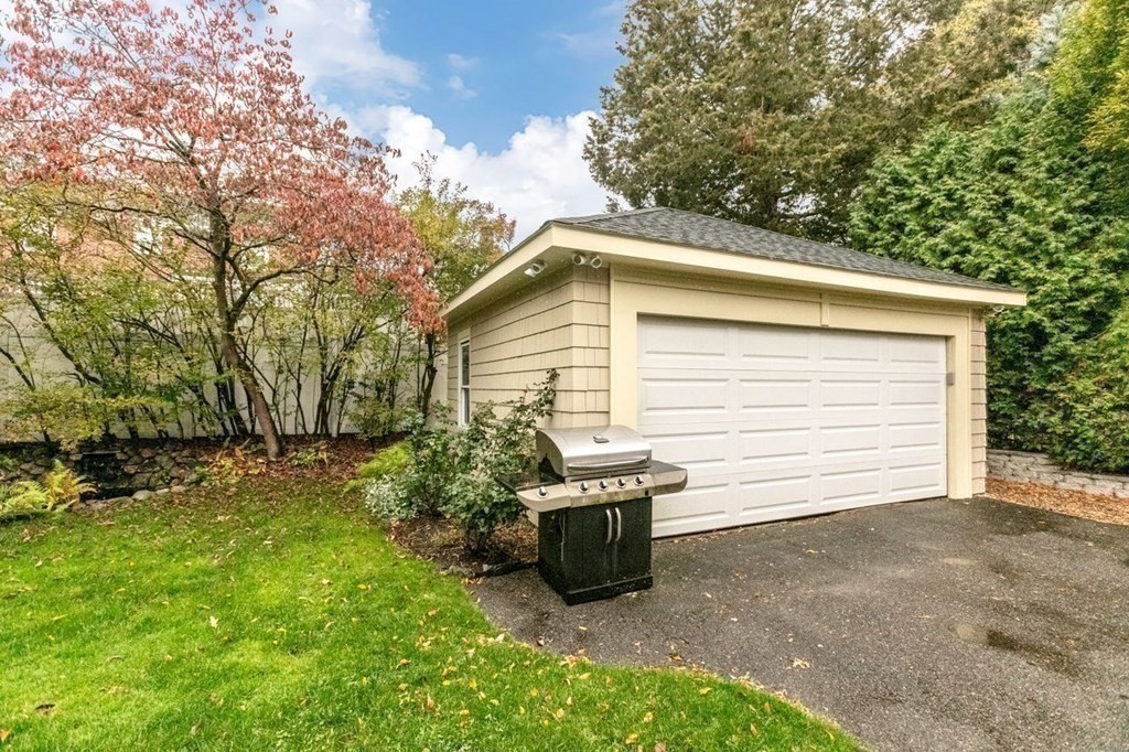 72 Shepherd Road Medford, MA 02155 - Photo 19 of 21 a view of a backyard with plants and a tree