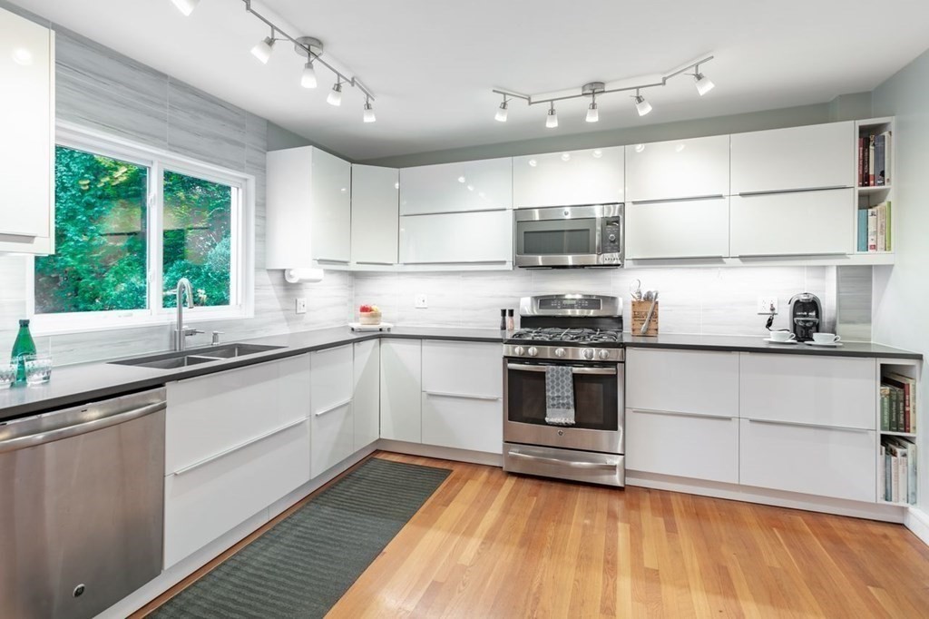 72 Shepherd Road Medford, MA 02155 - Photo 4 of 21 a kitchen with stainless steel appliances a stove sink and cabinets