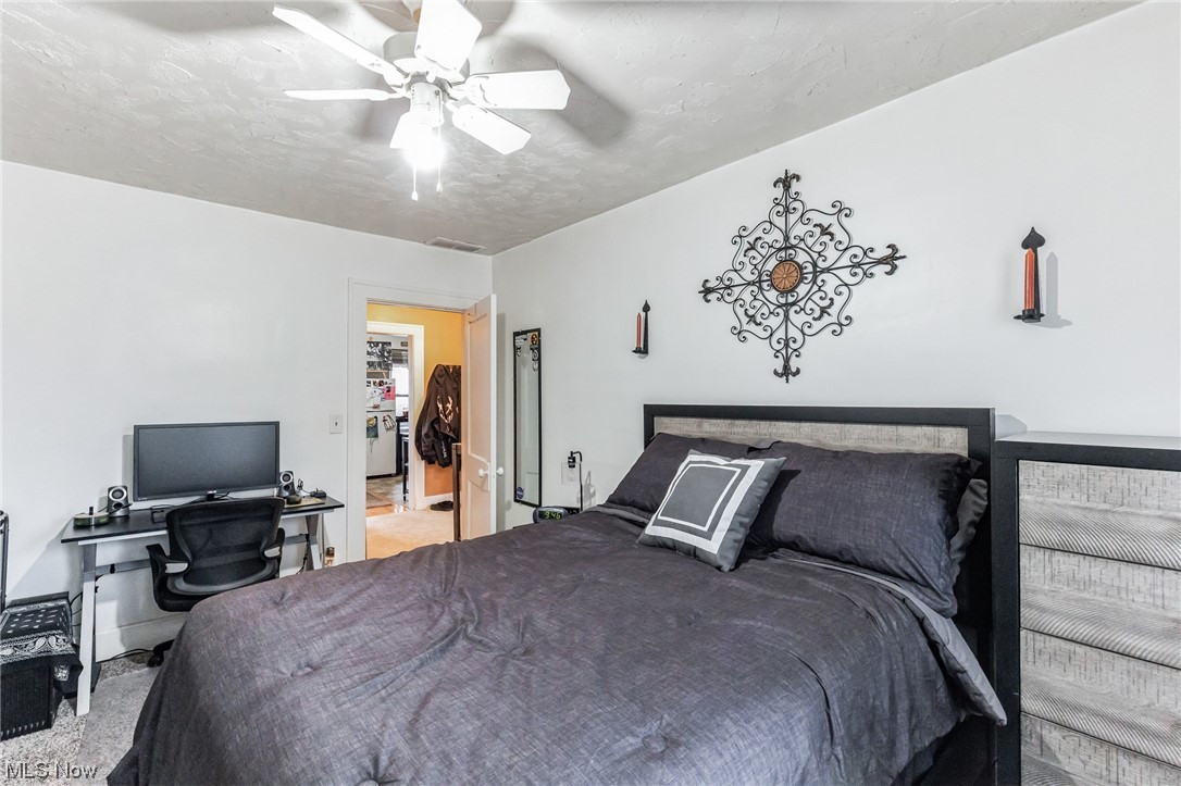 5880 State Road Cleveland, OH 44134 - Photo 19 of 21 Bedroom with ceiling fan and light carpet