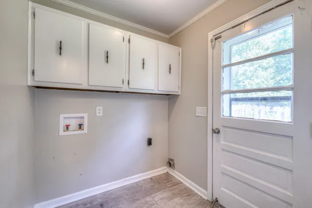 a view of cabinets and window