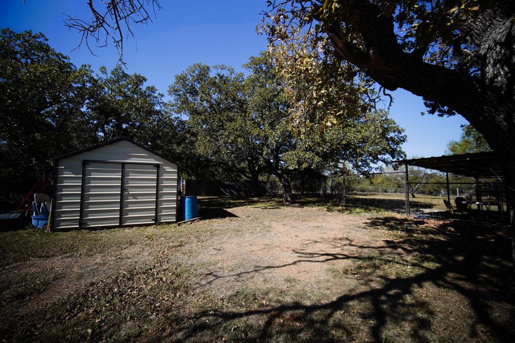 334 Cook Road Jacksboro, TX 76458 - Photo 10 of 20 a view of wooden house and a yard
