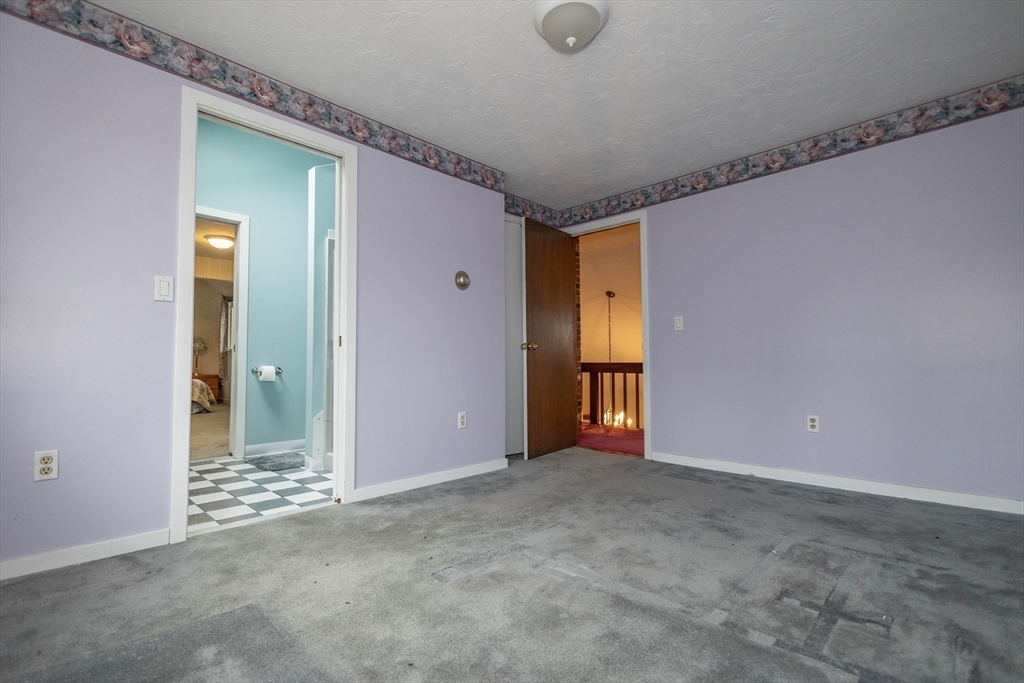 10 Nancy Road Natick, MA 01760 - Photo 11 of 19 an empty room with closet and mirror