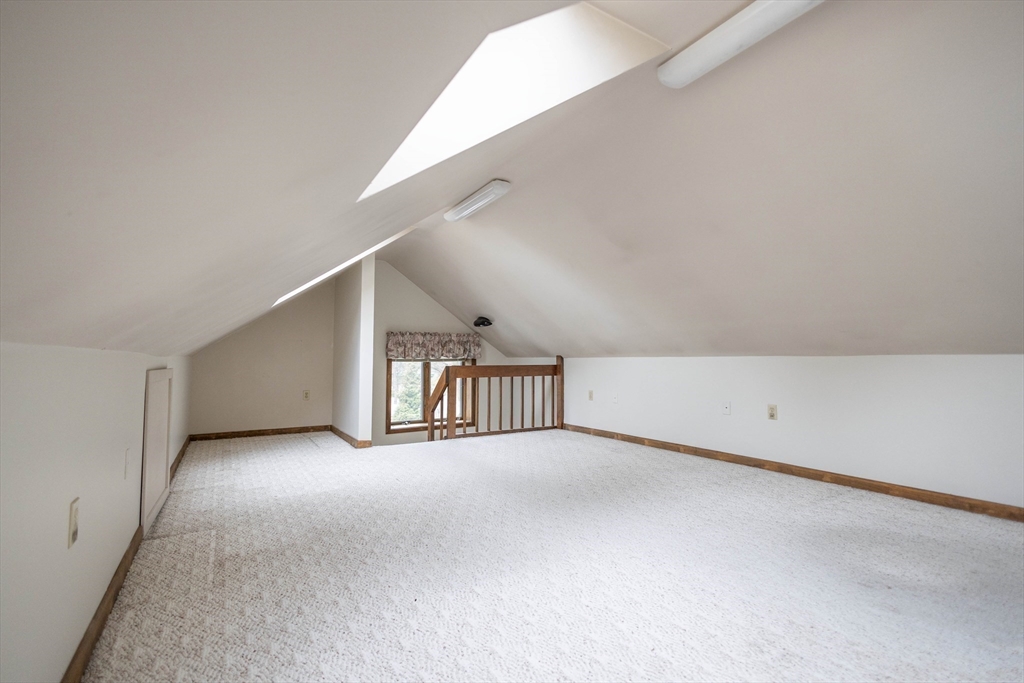 10 Nancy Road Natick, MA 01760 - Photo 18 of 19 a view of an empty room with stairs