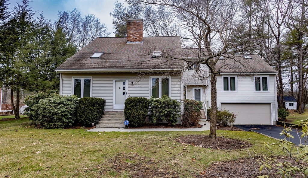 10 Nancy Road Natick, MA 01760 - Photo 3 of 19 a front view of house with yard and trees around