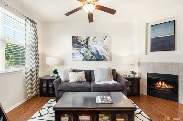 a living room with furniture and a fireplace