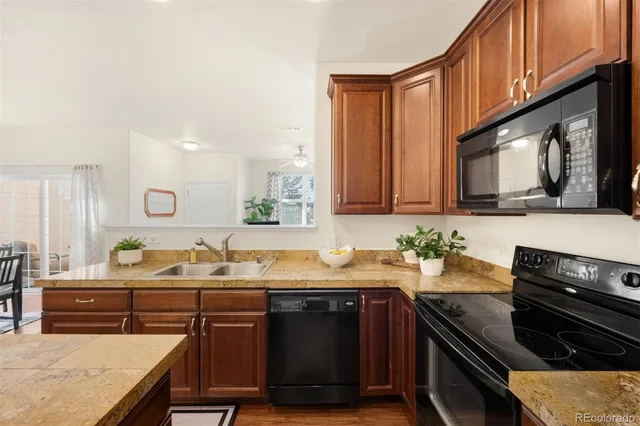 a kitchen with a sink stove and microwave